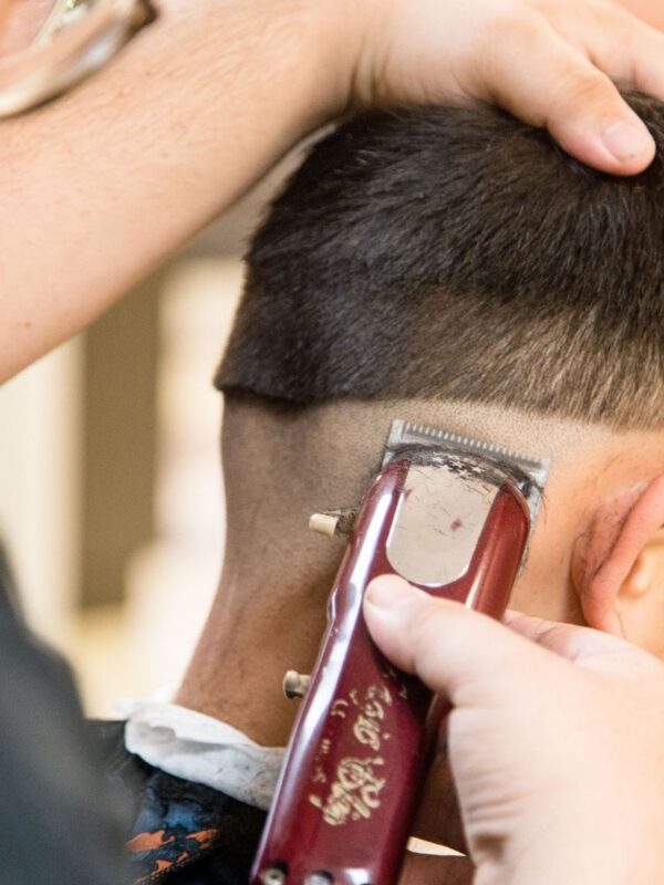 SSA student giving a haircut